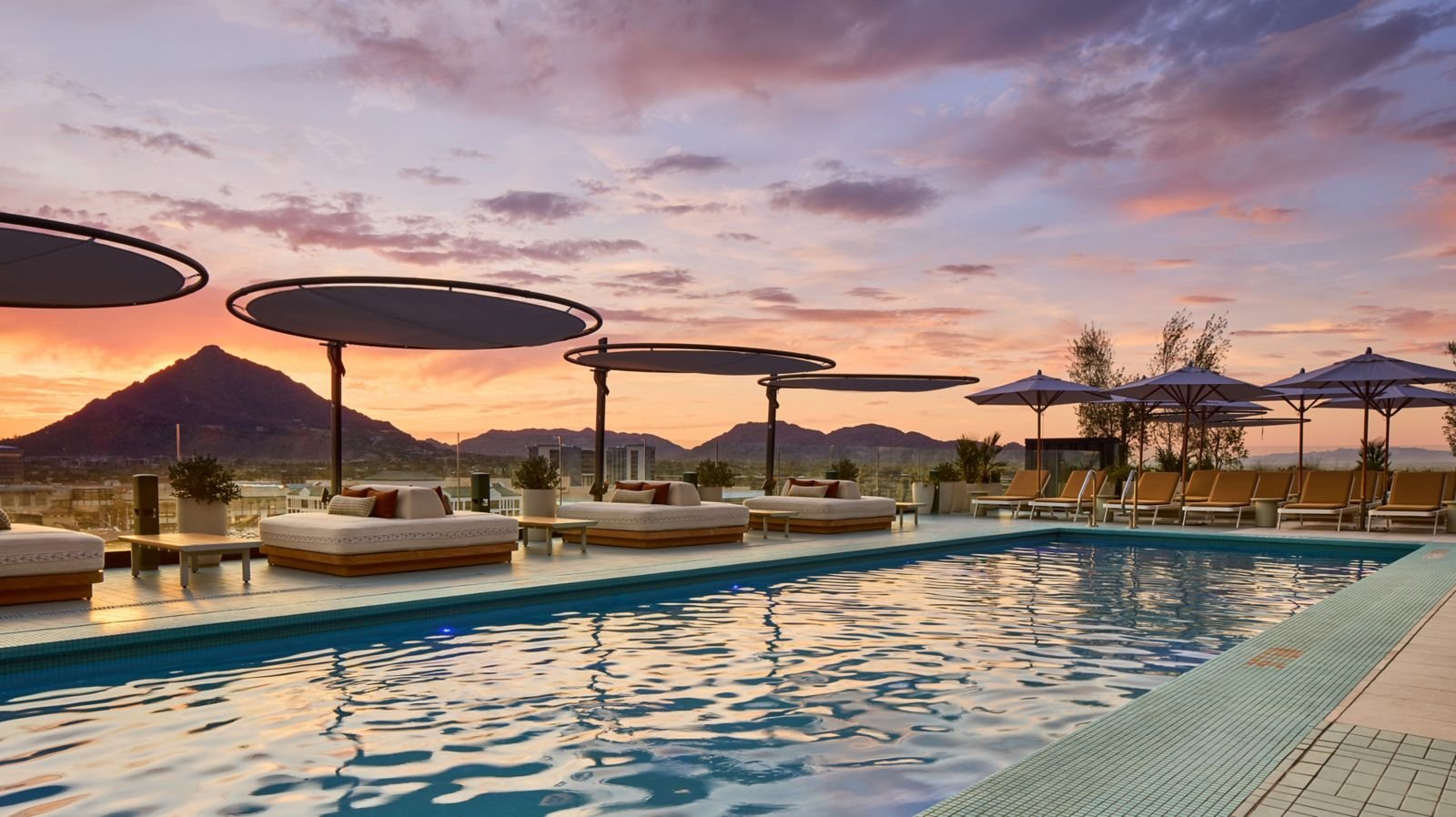 Allegra rooftop pool at The REMI Scottsdale glowing at sunset